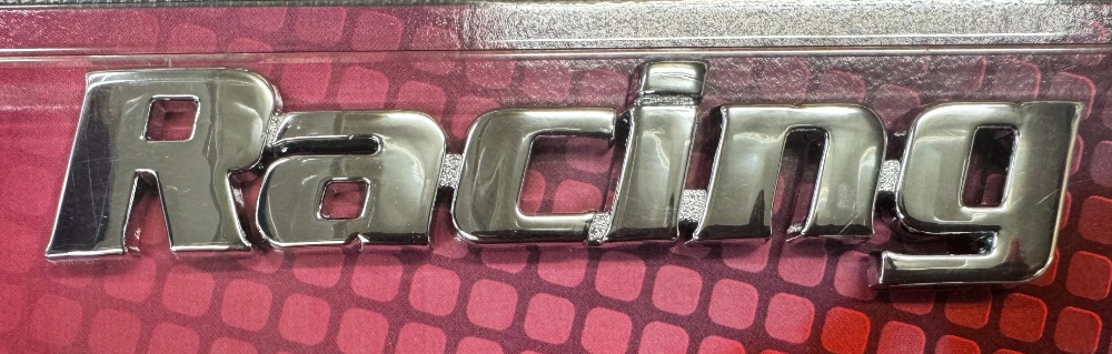 Racing stick on badge